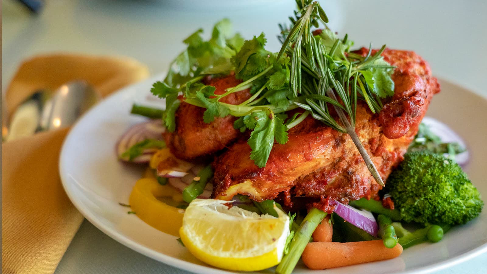 Tandoori chicken served sizzling with onions and peppers
